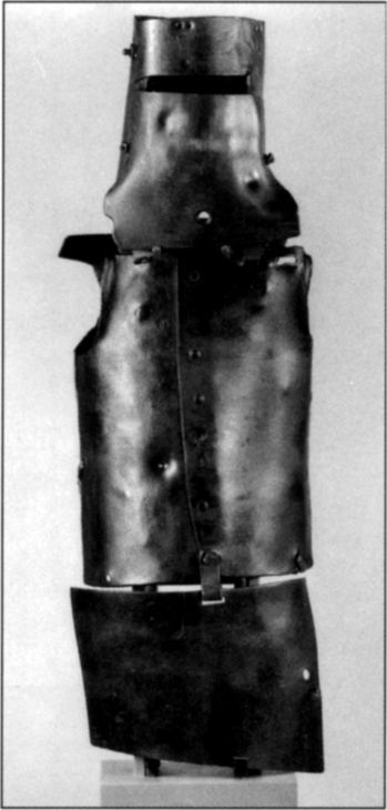 Adrian Flint, 1960 -, photographer. Set of six views of Ned Kelly's armour taken in the Conservation Section of the State Library of Victoria. Photograph shows front view. Gelatin silver photograph. [photograph]
