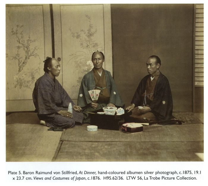 Plate 5. Baron Raimund von Stillfried, At Dinner, hand-coloured albumen silver photograph, c. 1875, 19.1 × 23.7 cm. Views and Costumes of Japan, c. 1876. H95.62/36. LTW 56, La Trobe Picture Collection.