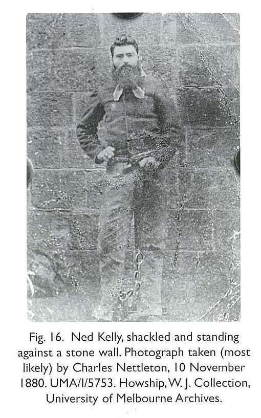 Fig. 16. Ned Kelly, shackled and standing against a stone wall. Photograph taken (most likely) by Charles Nettleton, 10 November 1880. UMA/I/5753. Howship, W. J. Collection, University of Melbourne Archives. [photograph]